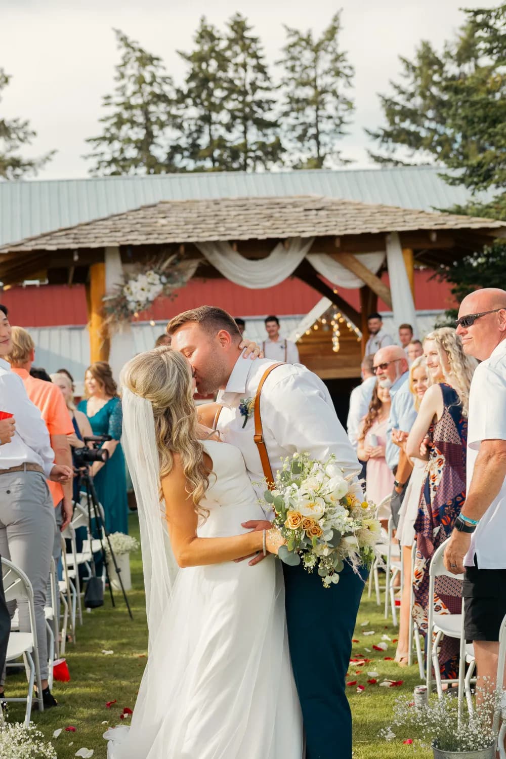 Sweet kiss on wedding day after ceremony kiss