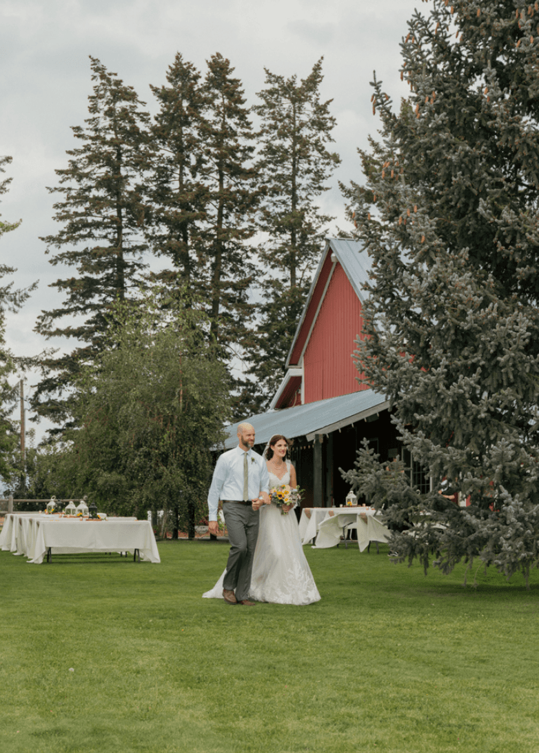 Father walking his daughter the bride outside down the aisle
